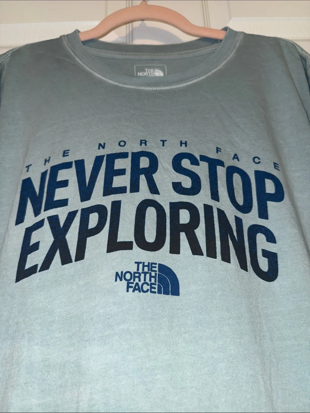 The North Face Sage Green Tee with Navy 'Never Stop Exploring' Print